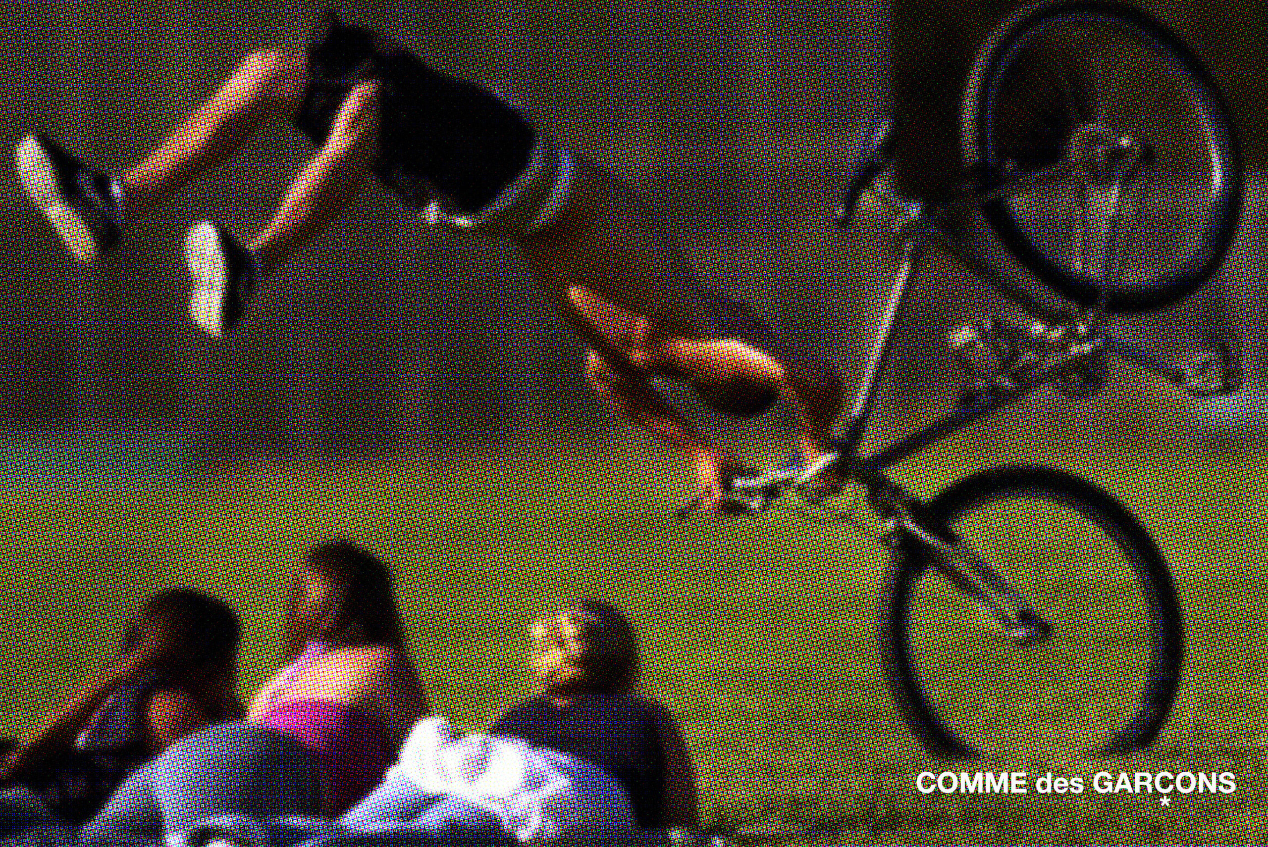 (a halftone image of a shirtless person falling backward over the handlebars of a bicycle as three onlookers observe from their position lying on the grass)